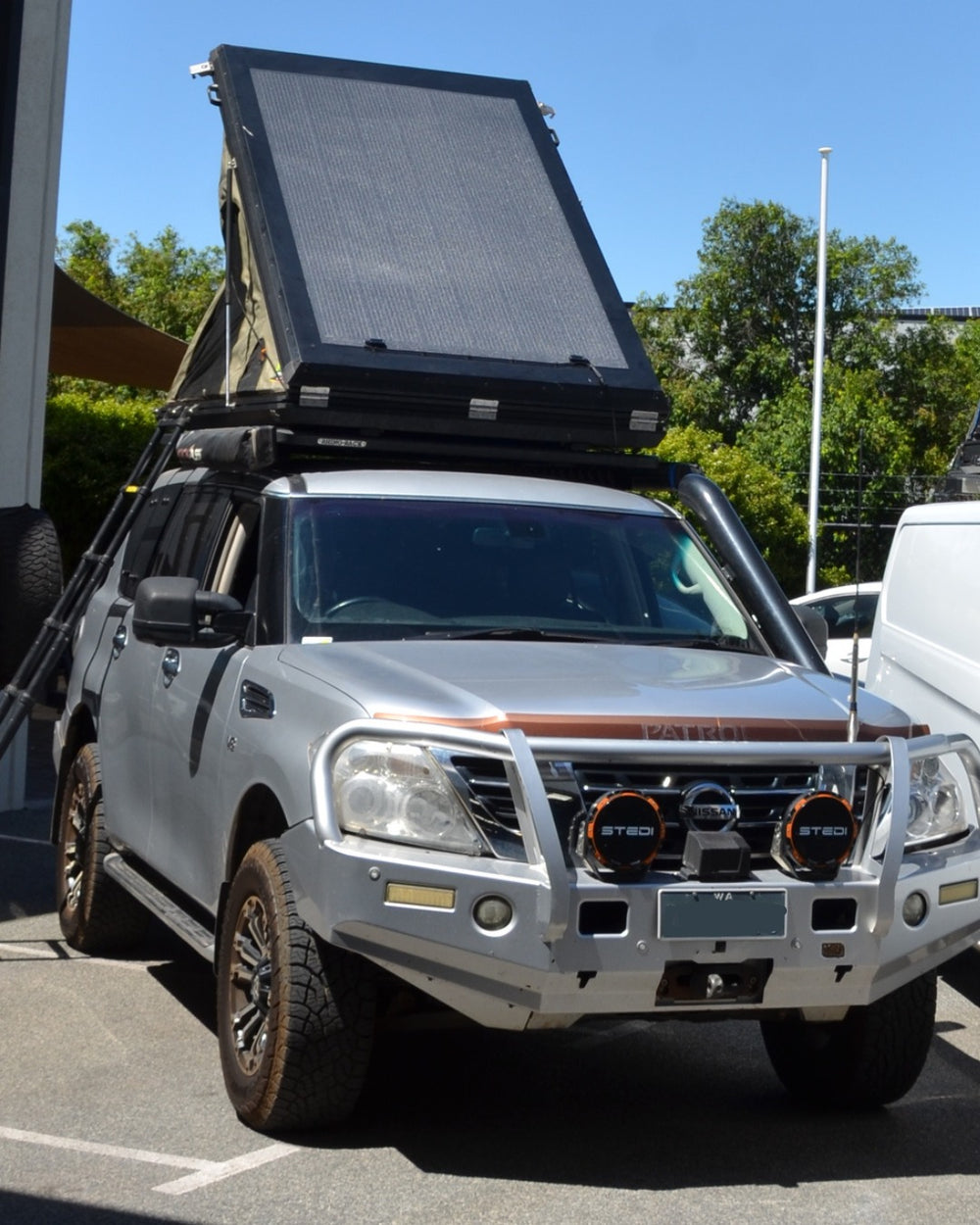 Custom hard shell rooftop tent solar project